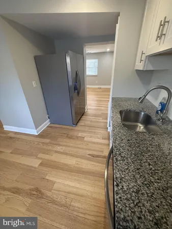 a bathroom with a sink and mirror