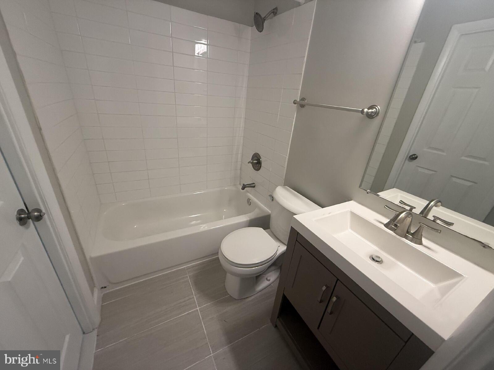 5 Bohn Court Rosedale, MD 21237 - Photo 5 of 14 a bathroom with a sink toilet vanity and shower
