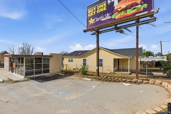 a view of a street with an outdoor space