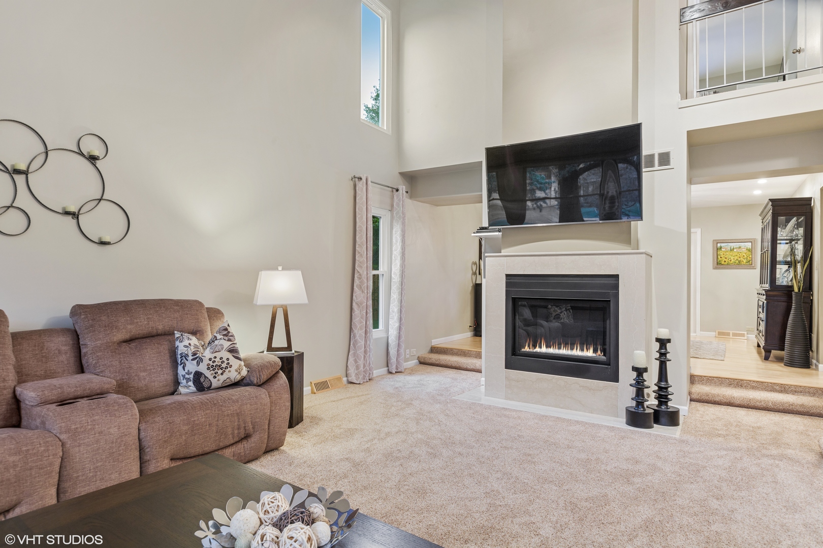 8460 Clynderven Road Burr Ridge, IL 60527 - Photo 5 of 27 a living room with furniture and a fireplace