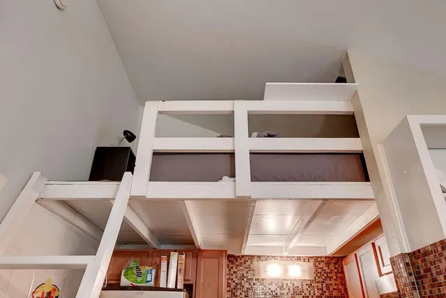 a view of furniture and utility room with empty racks