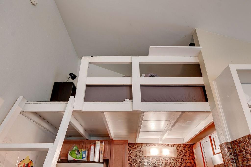 1000 West 26th Street, Unit 216 Austin, TX 78705 - Photo 13 of 16 a view of furniture and utility room with empty racks