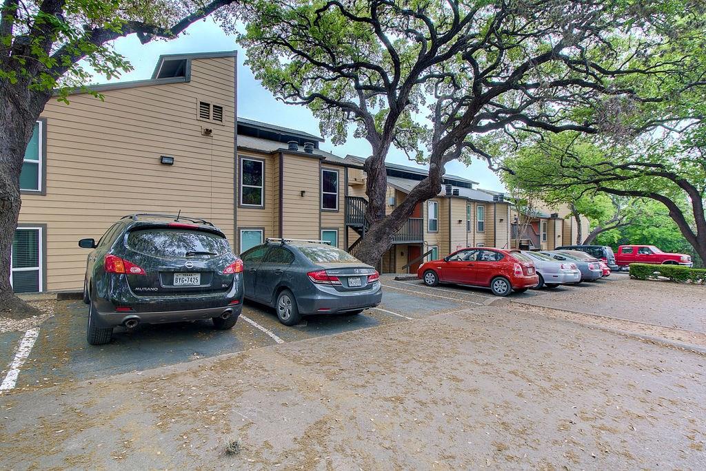 1000 West 26th Street, Unit 216 Austin, TX 78705 - Photo 2 of 16 a view of cars parked in front of a house