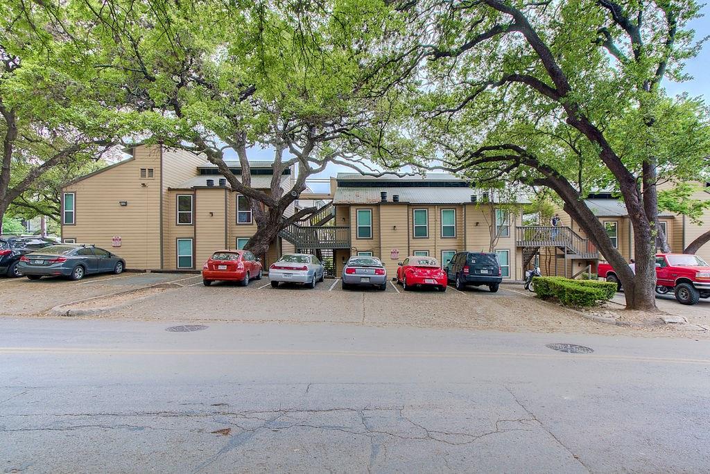 1000 West 26th Street, Unit 216 Austin, TX 78705 - Photo 3 of 16 a view of a cars parked in front of a house