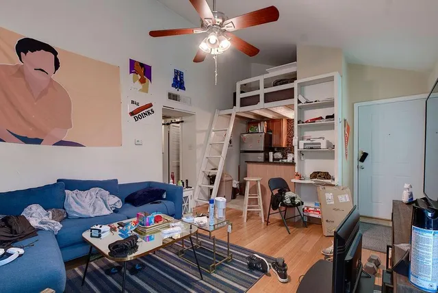 a living room with lots of furniture and white walls