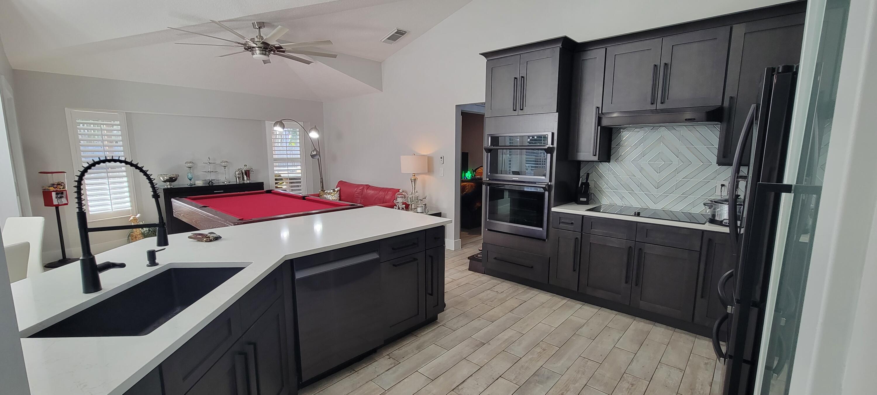 886 Southwest Curtis Street Port St. Lucie, FL 34983 - Photo 16 of 69 Large Kitchen & Glass Door Pantry