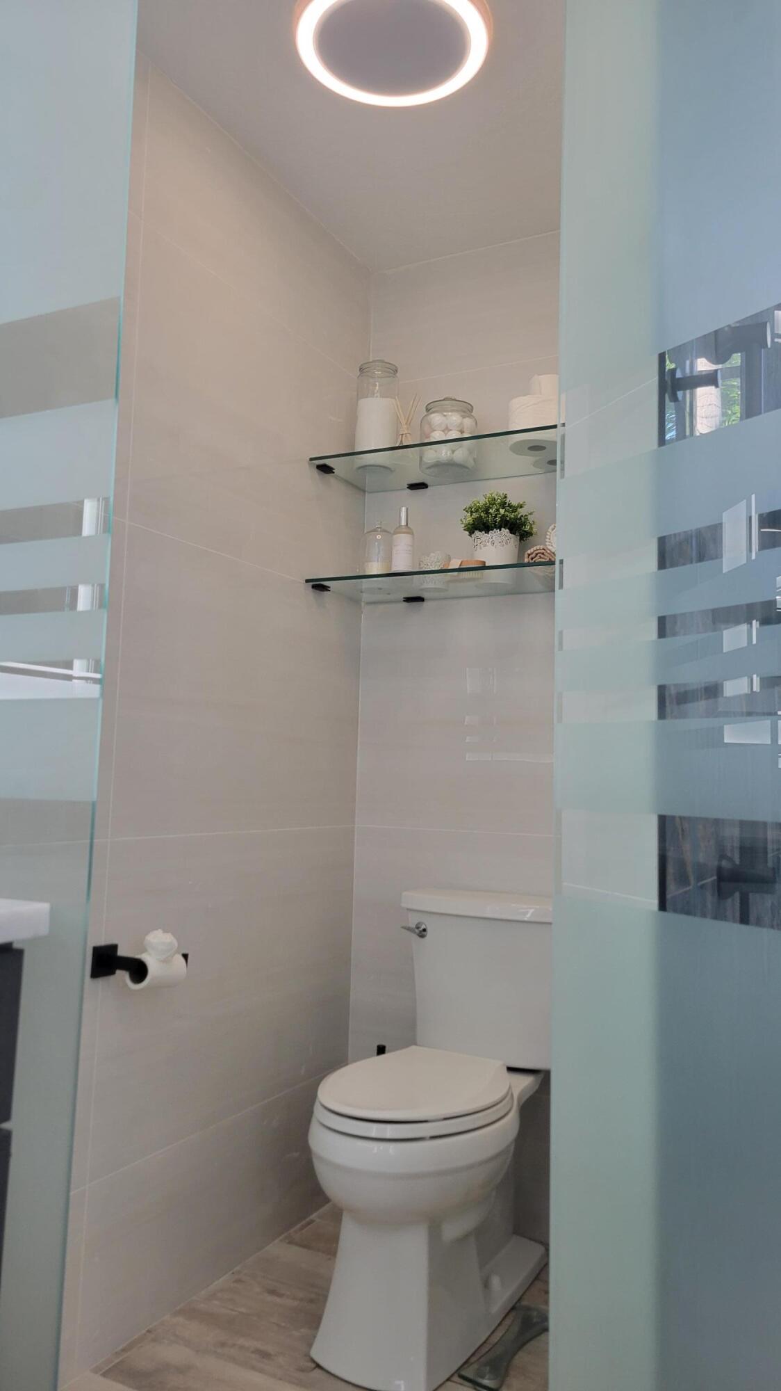 886 Southwest Curtis Street Port St. Lucie, FL 34983 - Photo 43 of 69 Frosted Glass Enclosed Master Bathroom