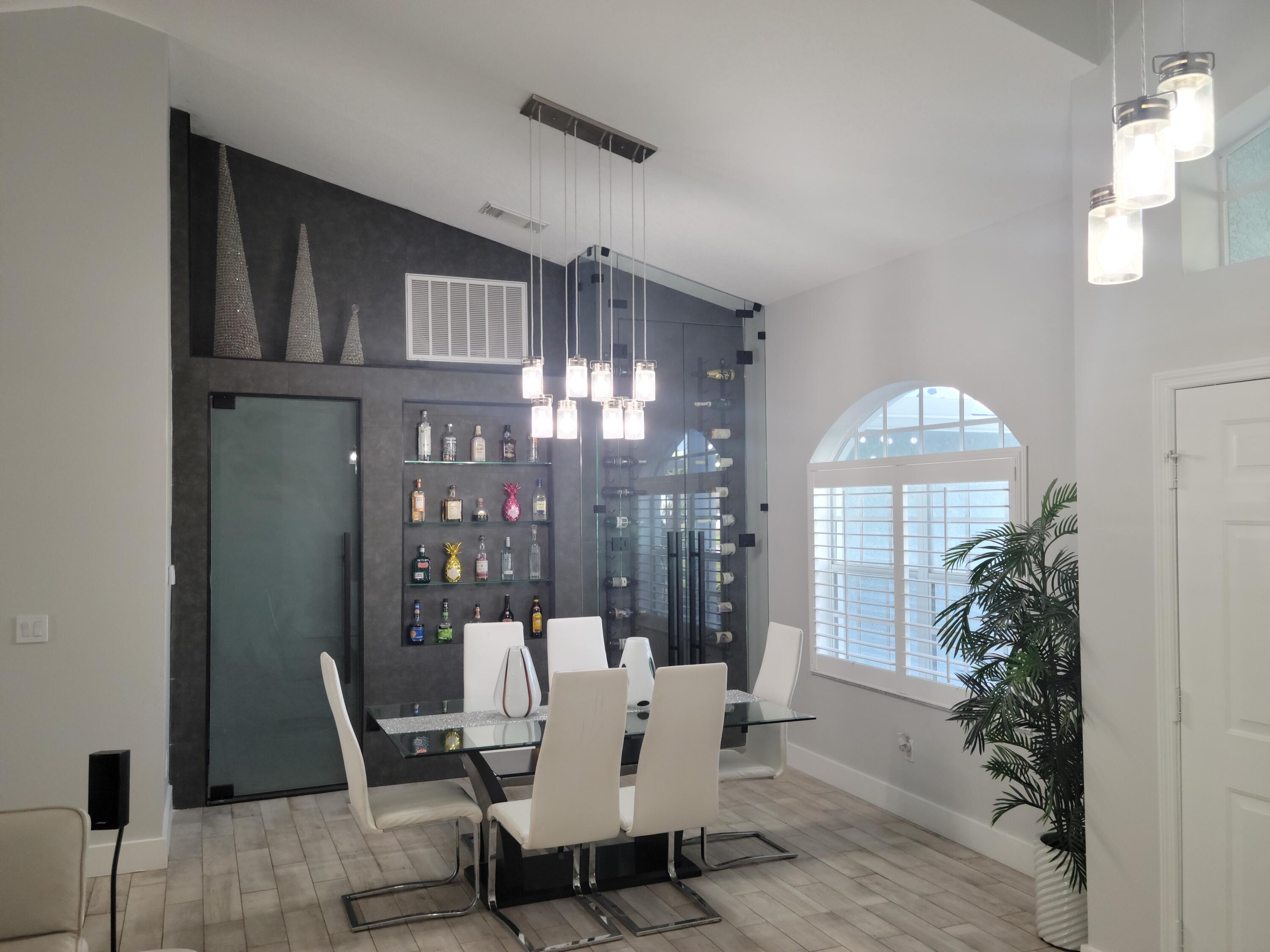 886 Southwest Curtis Street Port St. Lucie, FL 34983 - Photo 8 of 69 Formal Dining / Wine Bar Encasement