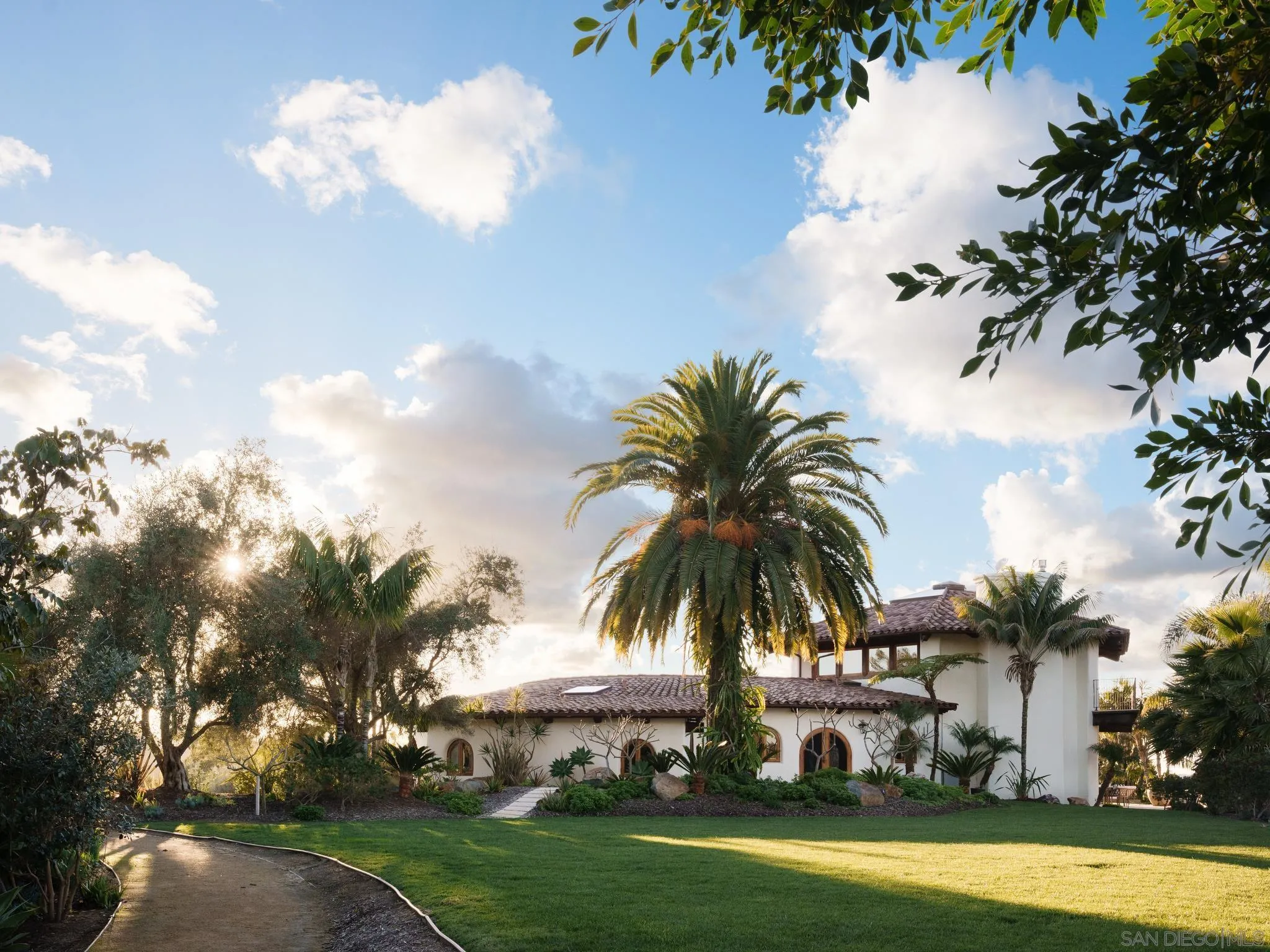4560 Via Gaviota Rancho Santa Fe, CA 92067 - Photo 20 of 28 a view of a swimming pool and trees in the background