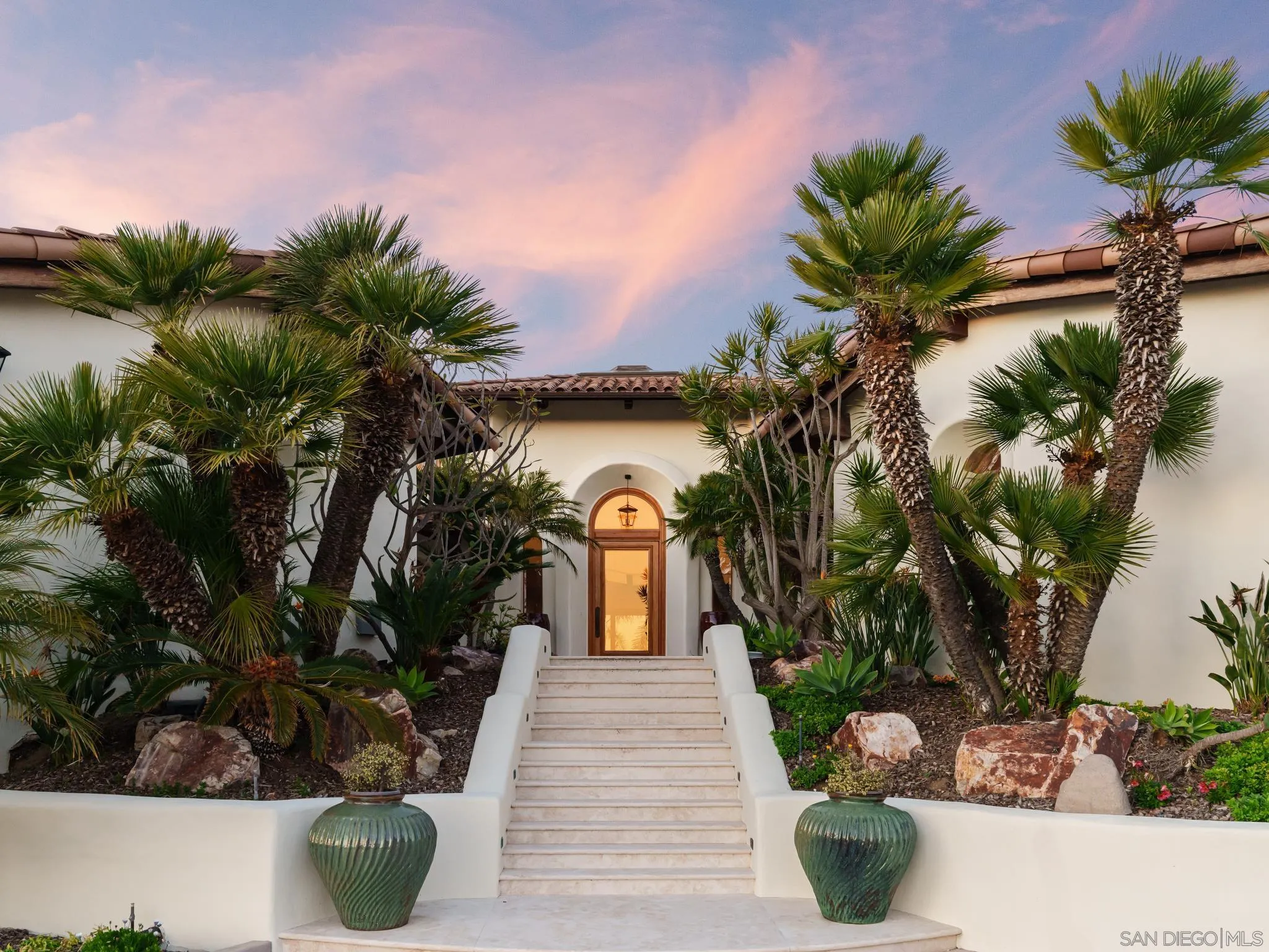 4560 Via Gaviota Rancho Santa Fe, CA 92067 - Photo 2 of 28 a front view of a house with a garden