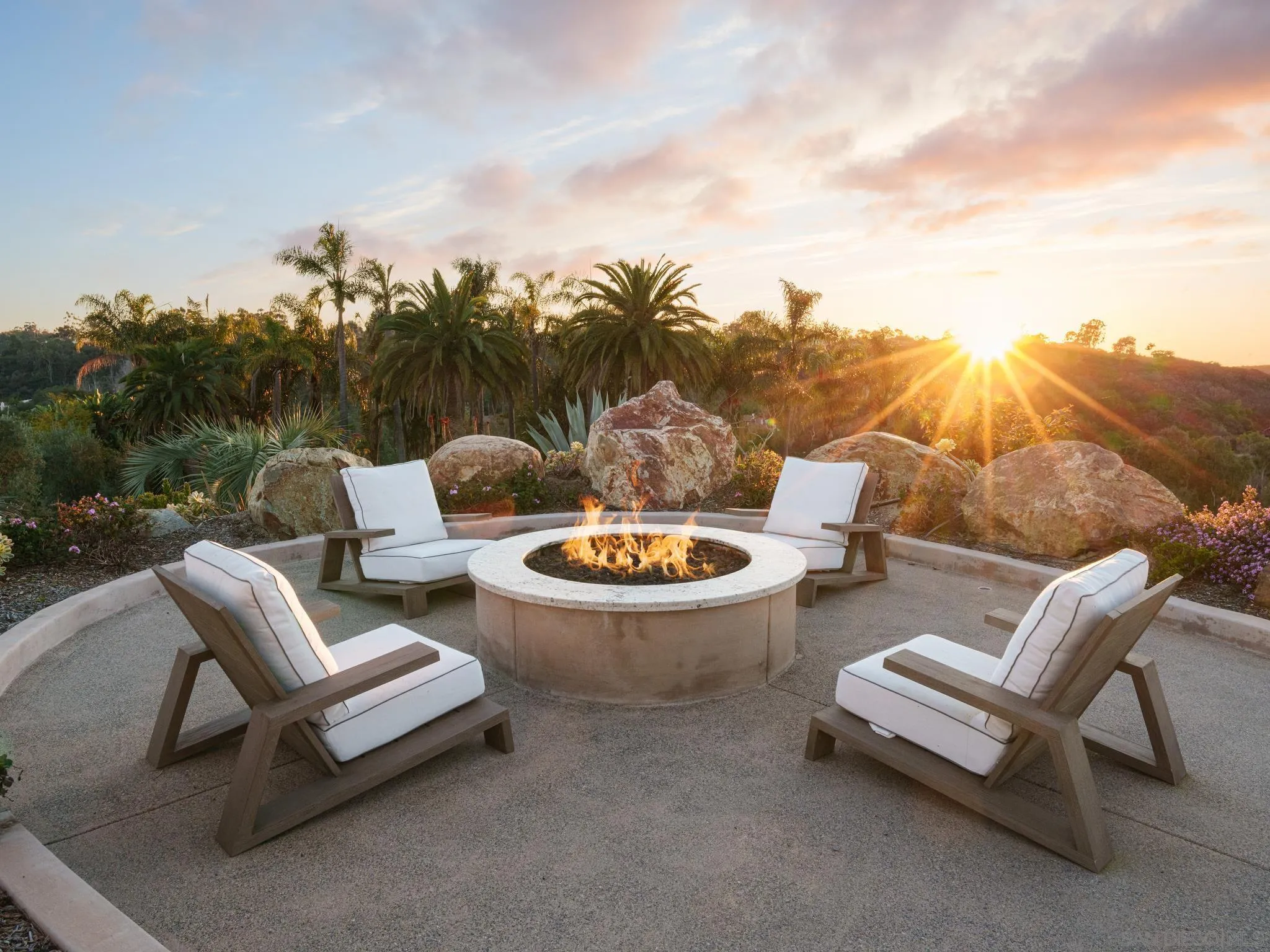 4560 Via Gaviota Rancho Santa Fe, CA 92067 - Photo 21 of 28 a view of a patio with couches table and chairs and potted plants
