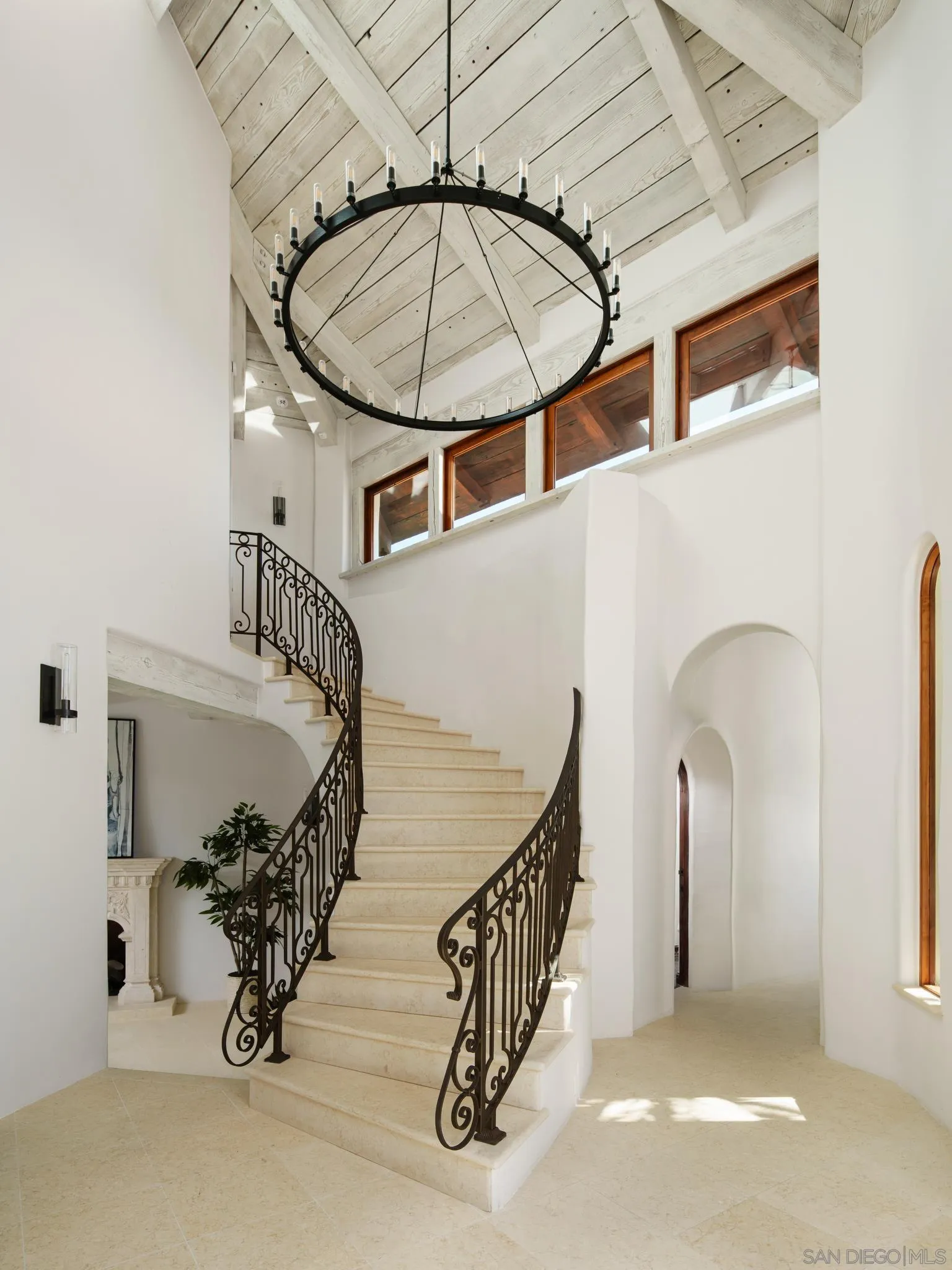 4560 Via Gaviota Rancho Santa Fe, CA 92067 - Photo 4 of 28 a view of staircase with a table and a chandelier