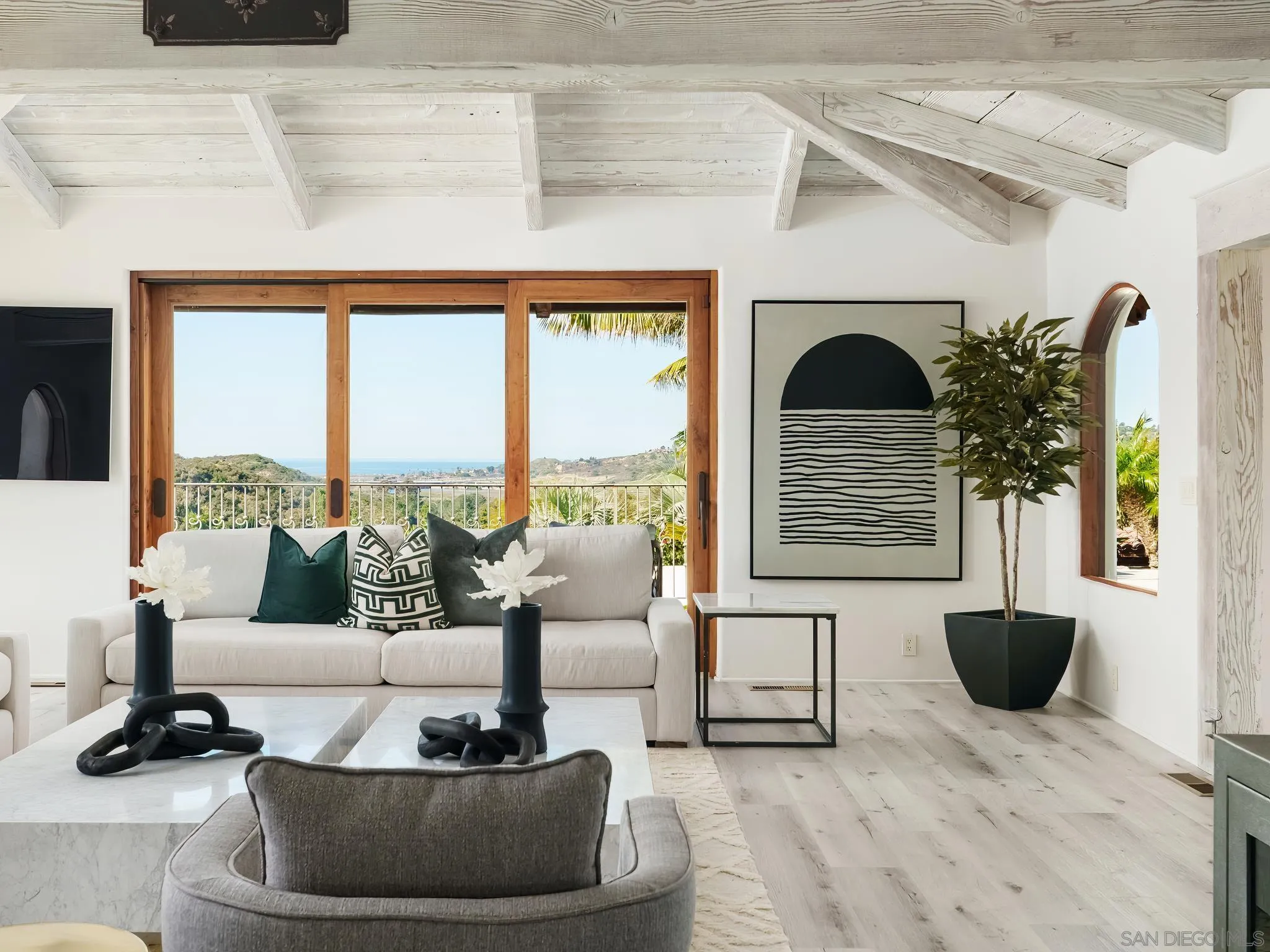 4560 Via Gaviota Rancho Santa Fe, CA 92067 - Photo 7 of 28 a living room with furniture and a floor to ceiling window