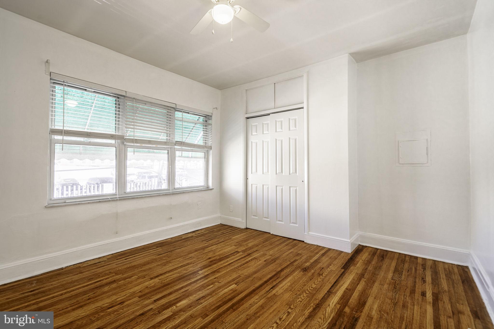 1314 West Ritner Street Philadelphia, PA 19148 - Photo 14 of 19 an empty room with wooden floor and windows