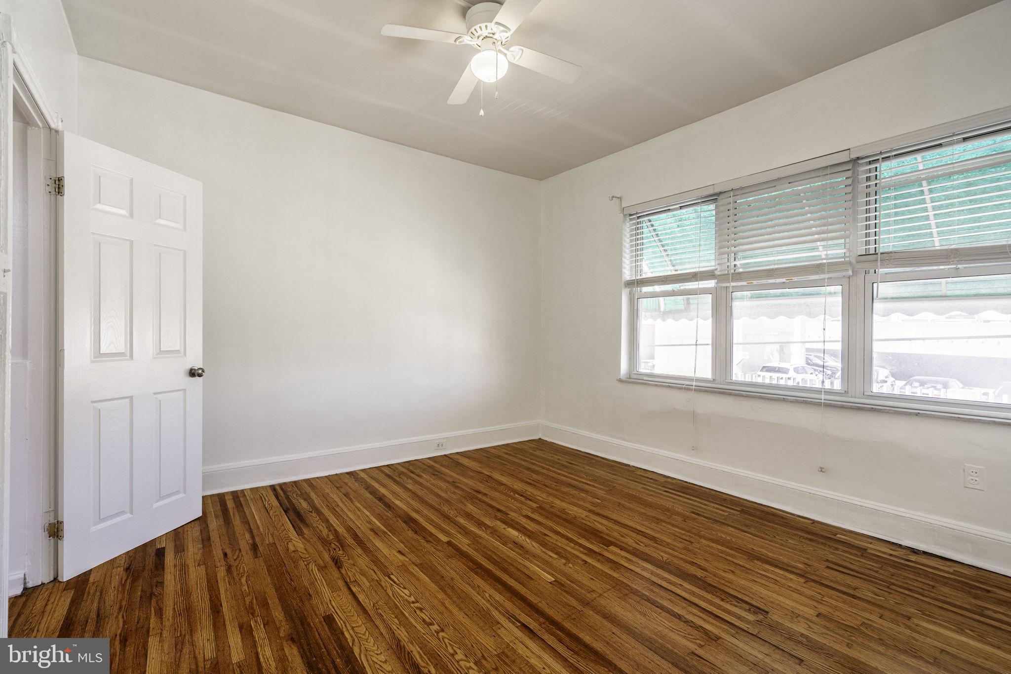 1314 West Ritner Street Philadelphia, PA 19148 - Photo 15 of 19 wooden floor in an empty room with a window