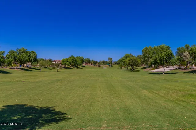 a view of a swimming pool with seating space