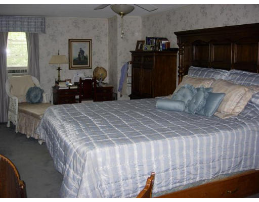 35 Blacksmith Road Wilbraham, MA 01095 - Photo 13 of 18 a bedroom with a bed and a dresser
