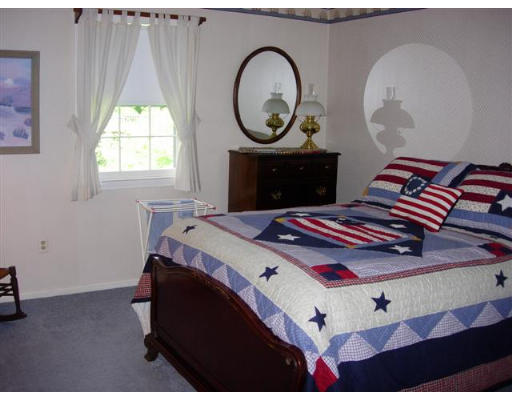 35 Blacksmith Road Wilbraham, MA 01095 - Photo 14 of 18 a bedroom with bed and a window