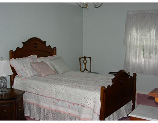 35 Blacksmith Road Wilbraham, MA 01095 - Photo 15 of 18 a bedroom with a bed and a mirror
