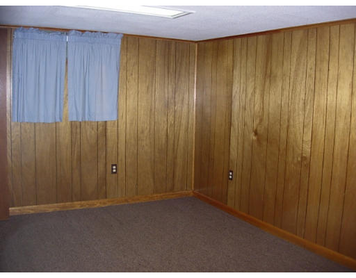 35 Blacksmith Road Wilbraham, MA 01095 - Photo 18 of 18 a view of an empty room with wooden walls