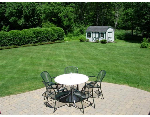 35 Blacksmith Road Wilbraham, MA 01095 - Photo 5 of 18 a view of a chairs and table in backyard