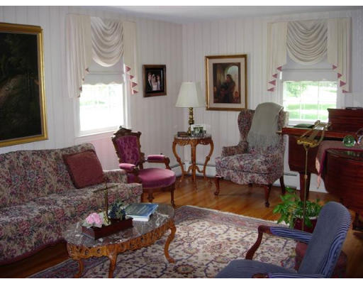 35 Blacksmith Road Wilbraham, MA 01095 - Photo 9 of 18 a living room with furniture wooden floor and a flat screen tv