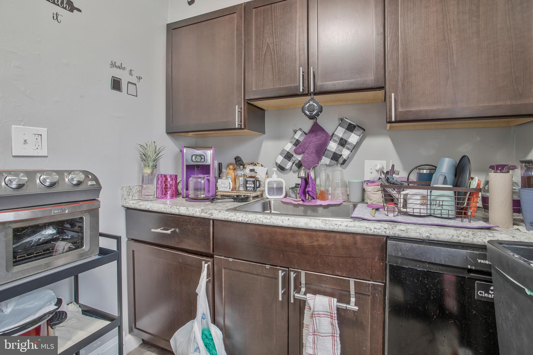 1123 Gleneagle Road Baltimore, MD 21239 - Photo 24 of 40 a kitchen with appliances cabinets and furniture