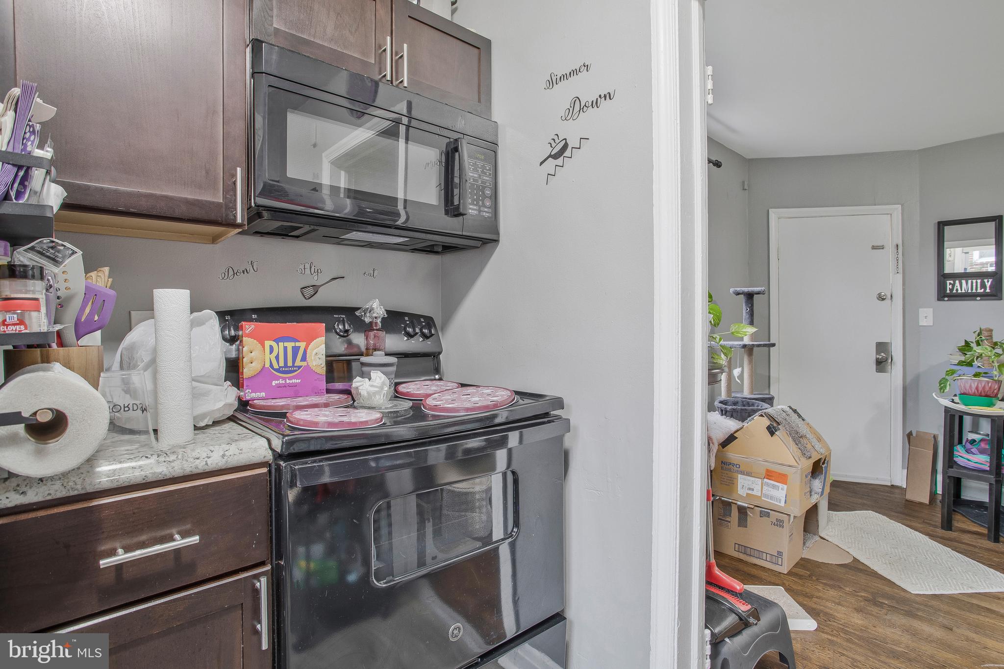 1123 Gleneagle Road Baltimore, MD 21239 - Photo 25 of 40 a kitchen with appliances a stove and cabinets