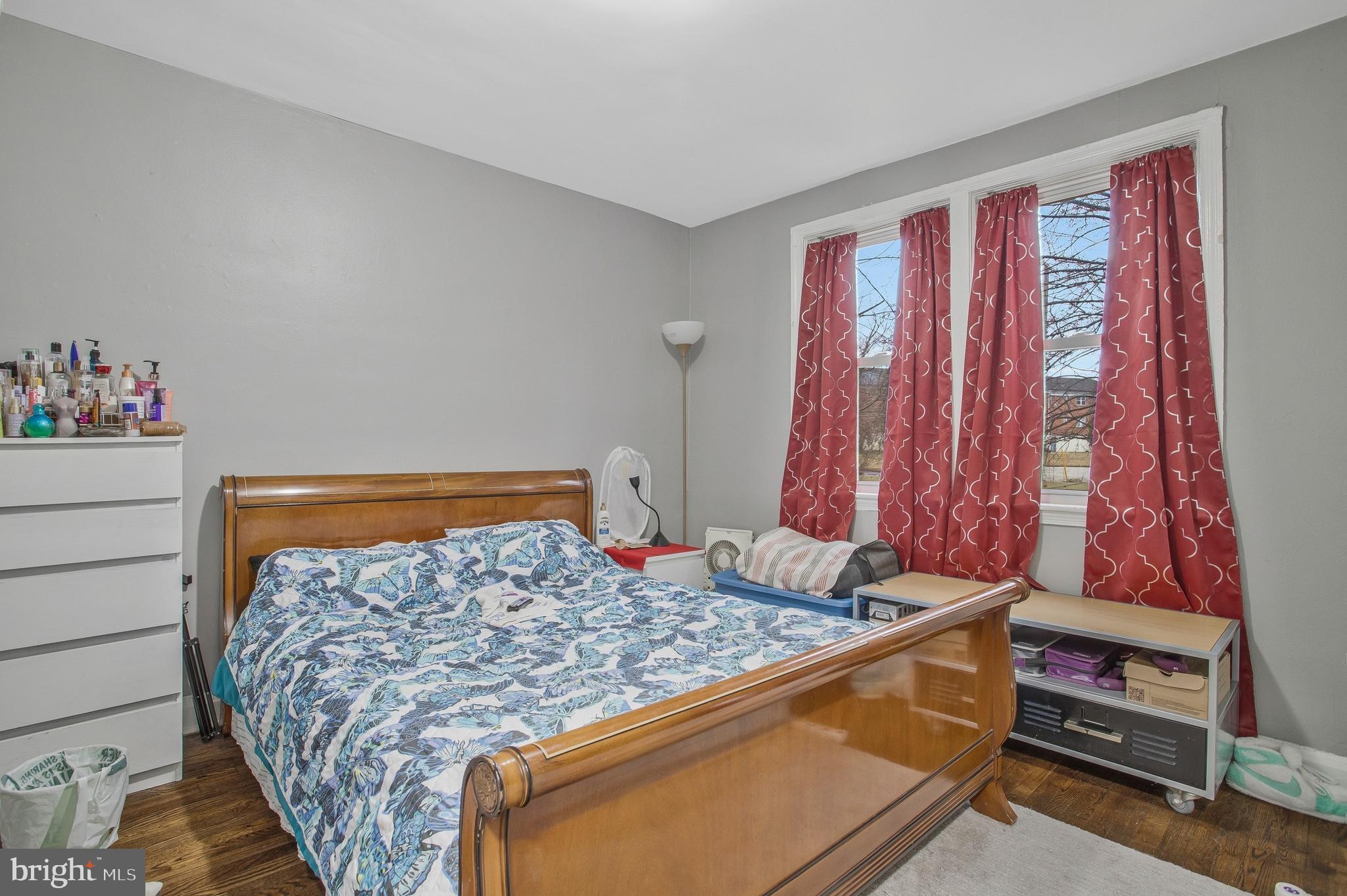 1123 Gleneagle Road Baltimore, MD 21239 - Photo 26 of 40 a bed sitting in a bedroom next to a window