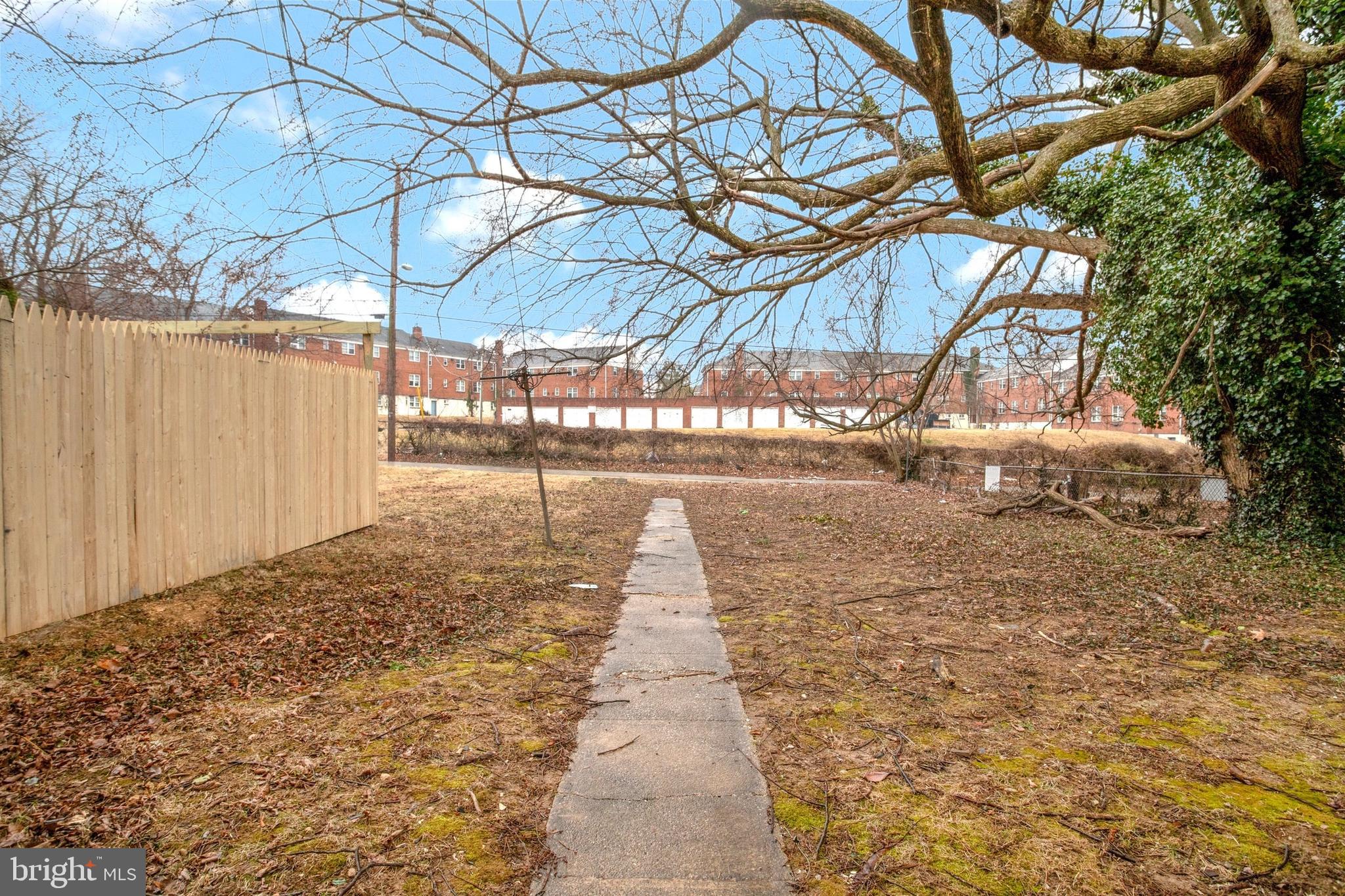 1123 Gleneagle Road Baltimore, MD 21239 - Photo 40 of 40 a street view with large trees
