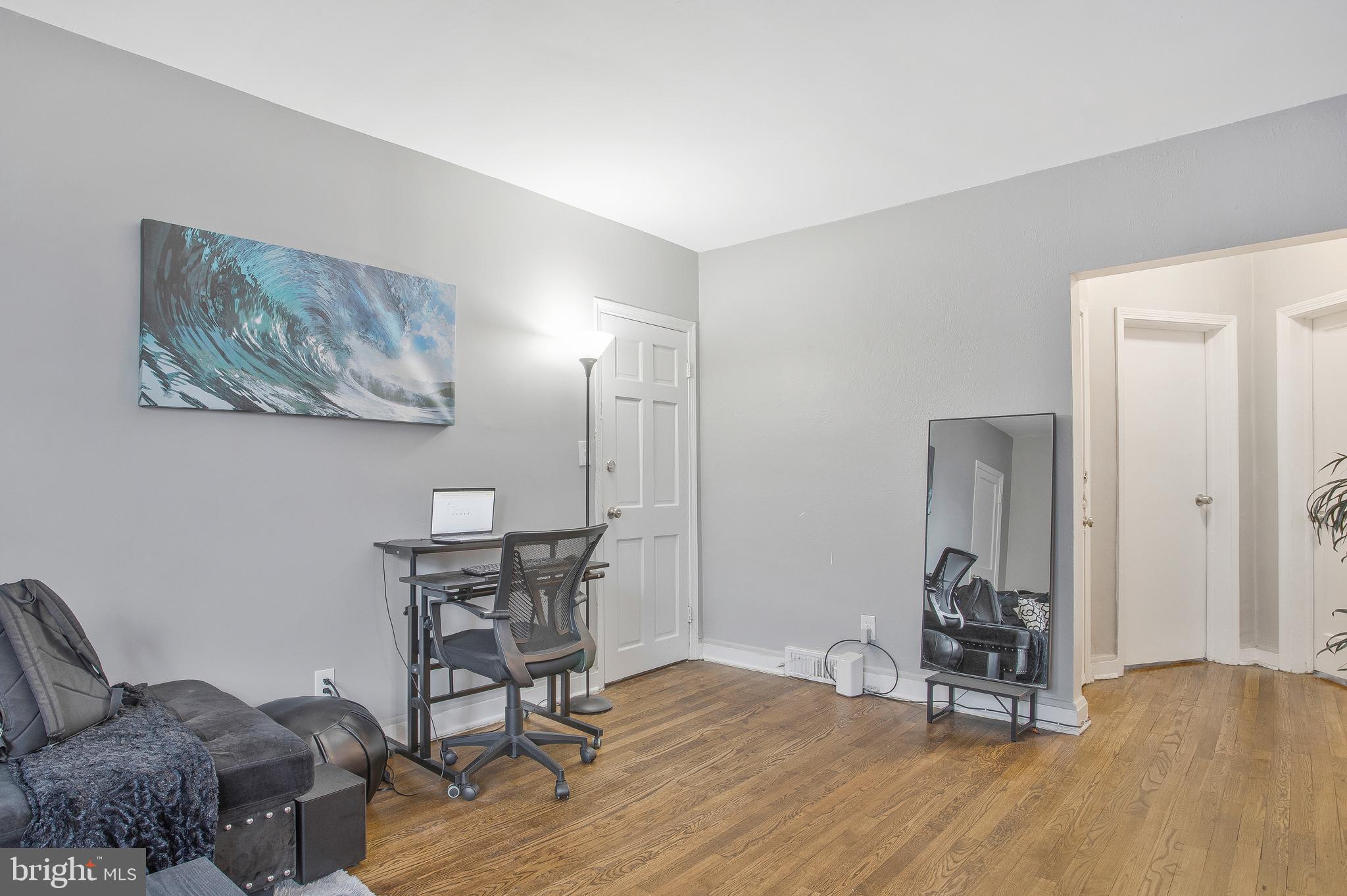 1123 Gleneagle Road Baltimore, MD 21239 - Photo 6 of 40 a view of a workspace with furniture and wooden floor