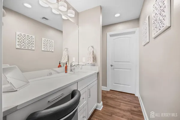 a bathroom with a sink a washer and dryer