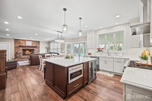 a large kitchen with a table and chairs