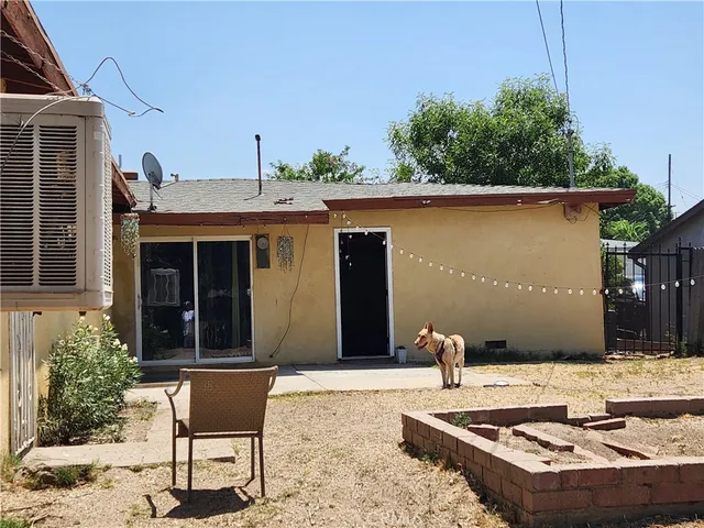 a view of a backyard of the house