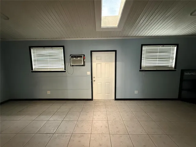 an empty room with windows