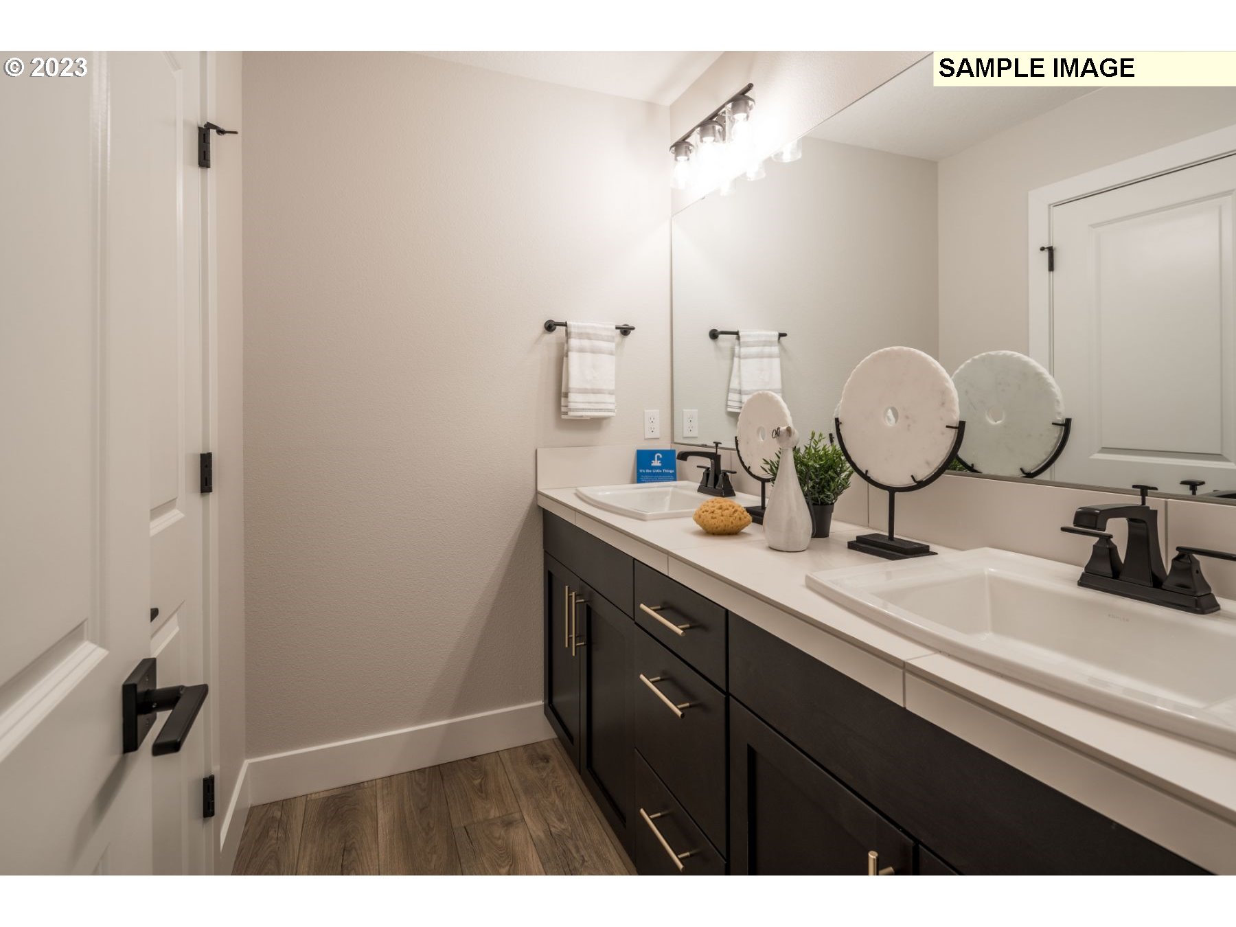 935 Northwest 178th Street Ridgefield, WA 98642 - Photo 14 of 24 a bathroom with a sink and a mirror