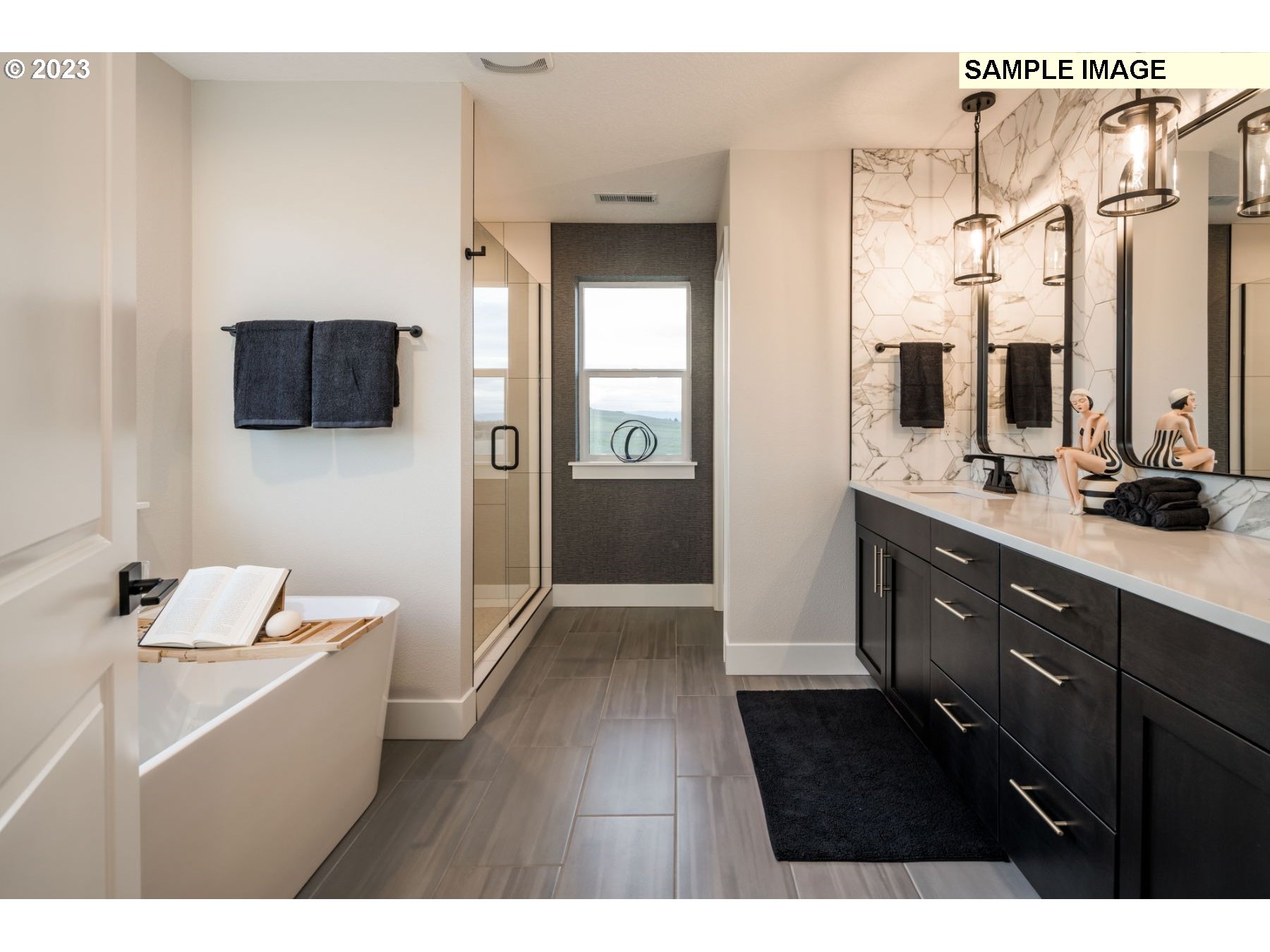 935 Northwest 178th Street Ridgefield, WA 98642 - Photo 16 of 24 a bathroom with a sink a mirror and a toilet