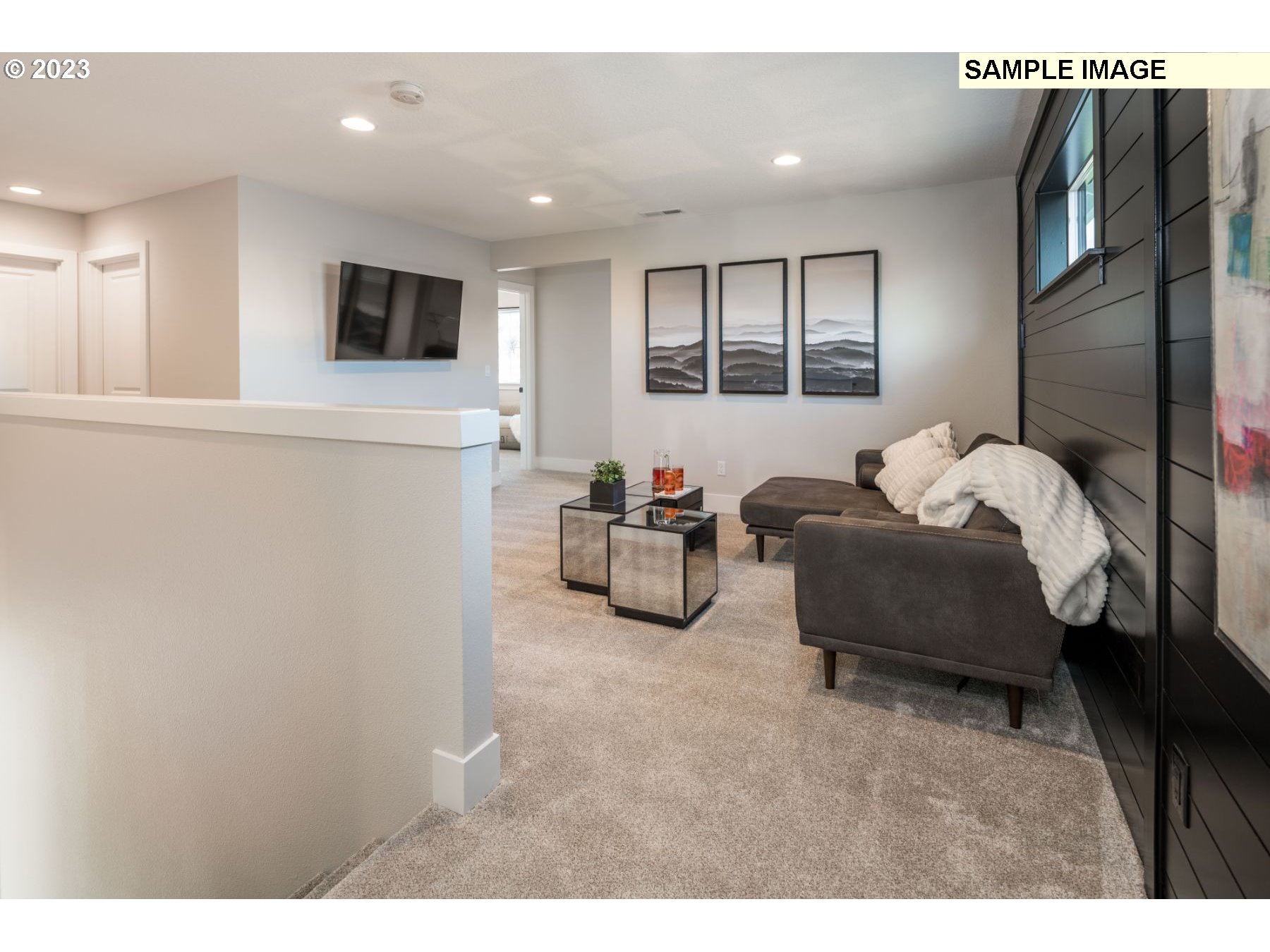935 Northwest 178th Street Ridgefield, WA 98642 - Photo 10 of 24 a living room with furniture and a flat screen tv