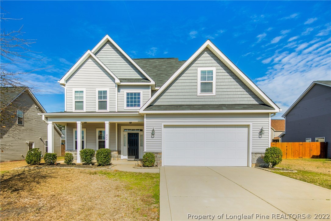 826 Harry Truman Road Fayetteville, NC 28311 - Photo 1 of 48 a front view of a house with a yard and garage