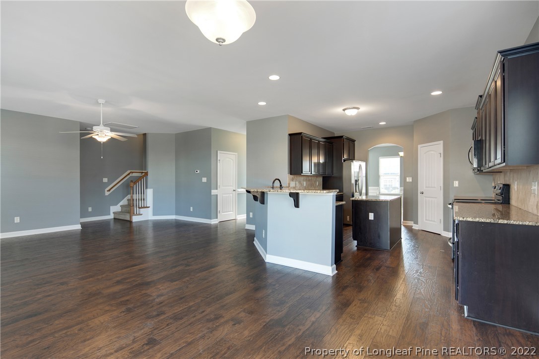 826 Harry Truman Road Fayetteville, NC 28311 - Photo 12 of 48 a view of a kitchen with cabinets stainless steel appliances a sink and a counter top space