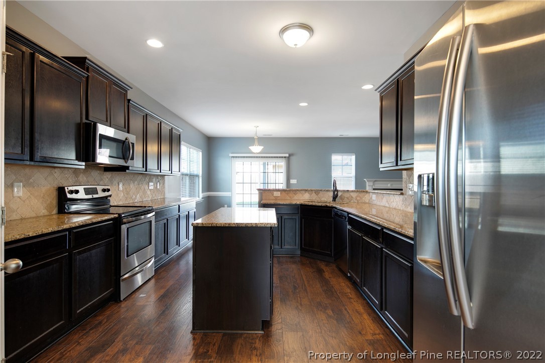 826 Harry Truman Road Fayetteville, NC 28311 - Photo 15 of 48 a kitchen with stainless steel appliances granite countertop a stove a sink dishwasher a refrigerator and a oven