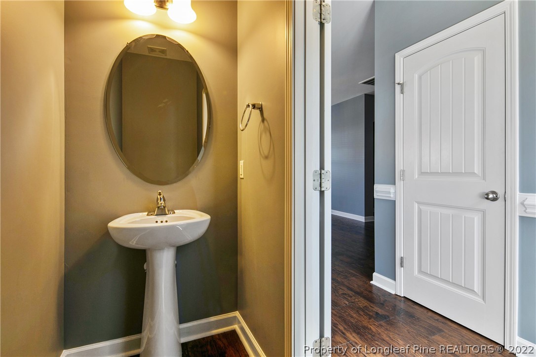 826 Harry Truman Road Fayetteville, NC 28311 - Photo 20 of 48 a bathroom with a sink and a mirror