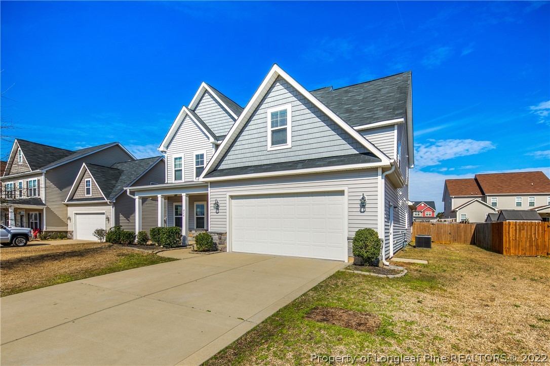 826 Harry Truman Road Fayetteville, NC 28311 - Photo 2 of 48 a front view of a house with a yard