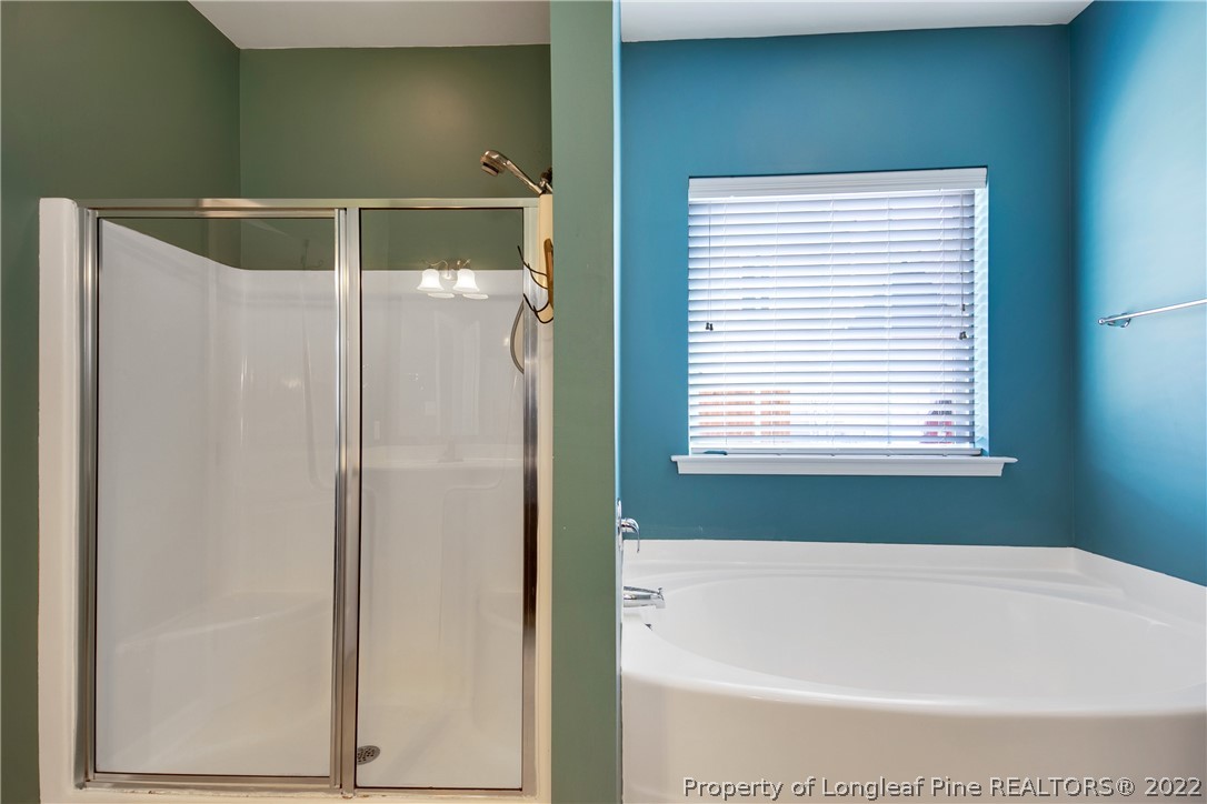 826 Harry Truman Road Fayetteville, NC 28311 - Photo 27 of 48 a bathroom with a bathtub and a shower