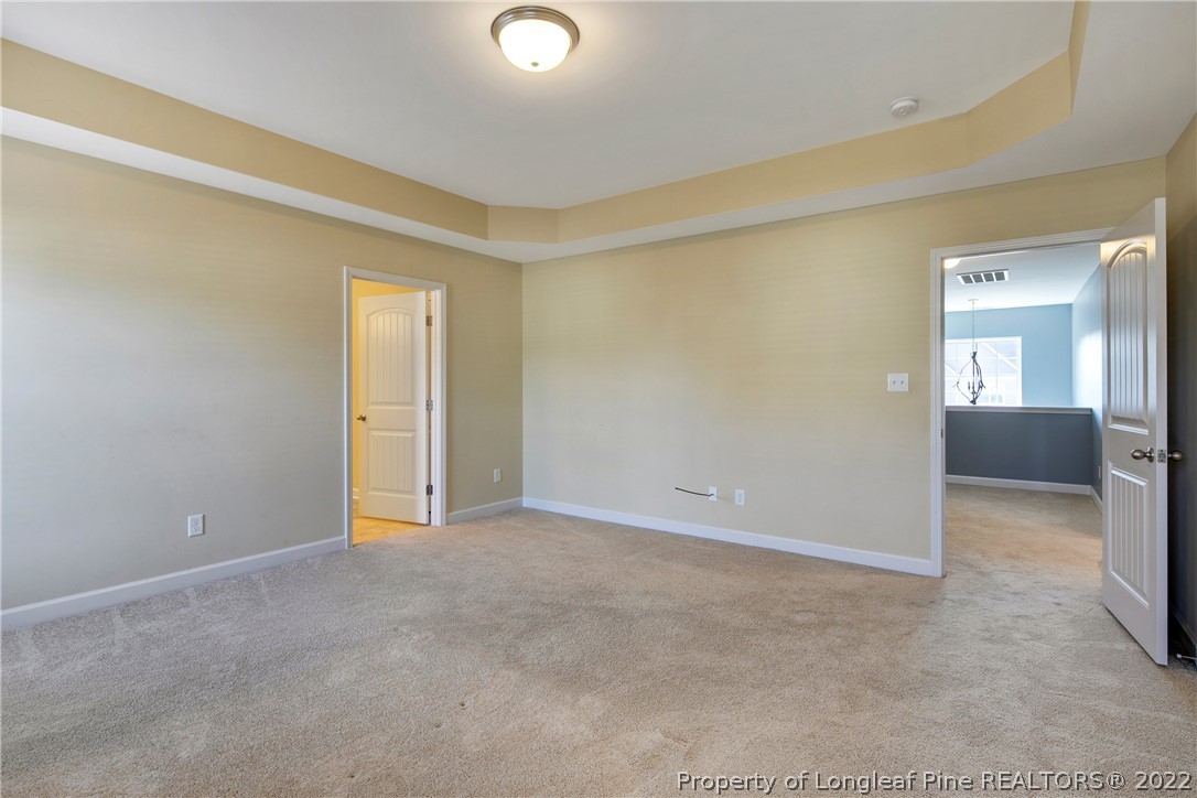 826 Harry Truman Road Fayetteville, NC 28311 - Photo 32 of 48 a view of an empty room with a mirror