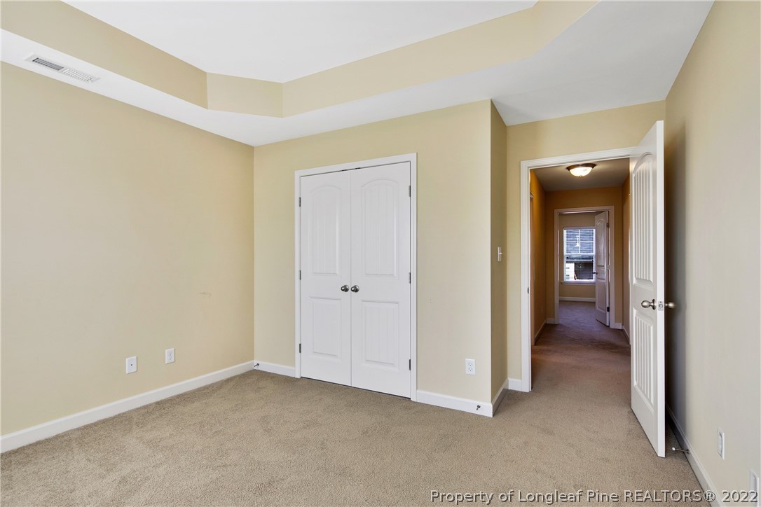 826 Harry Truman Road Fayetteville, NC 28311 - Photo 37 of 48 a view of a room with an empty space and wooden floor