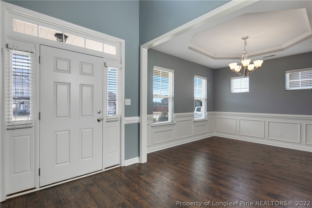 826 Harry Truman Road Fayetteville, NC 28311 - Photo 4 of 48 wooden floor in an empty room with a window