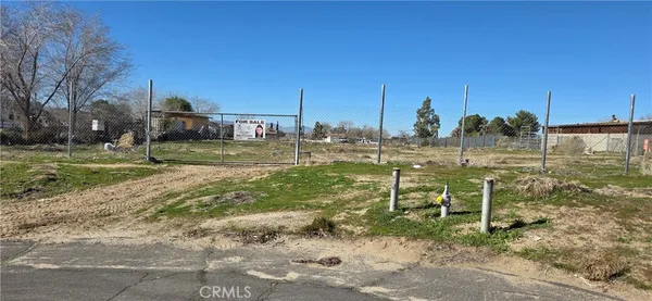 a view of a golf course with a bench