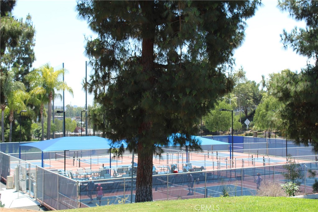 852 Ronda Mendoza, Unit Q Laguna Woods, CA 92637 - Photo 15 of 20 a view of a yard with plants and tree