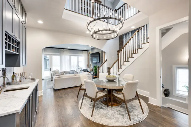 a view of entryway dining room and hall with wooden floor